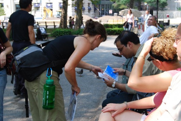 Eve talks to people in battery park