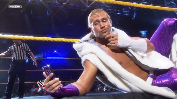 Tyler Breeze takes selfie's in the ring before and after the match