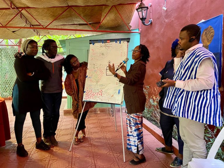 Center for Artistic Activism workshop participants planning an action