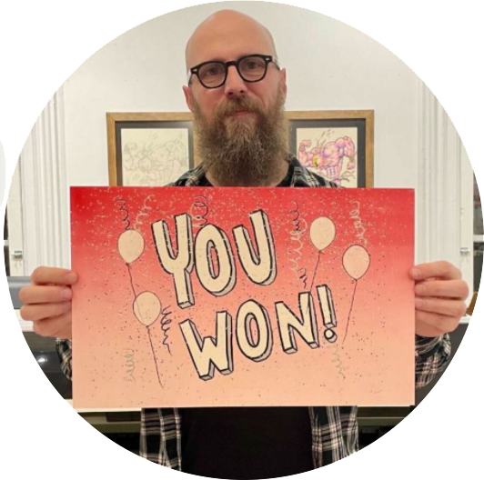 Steve Lambert holding a "You Won!" print