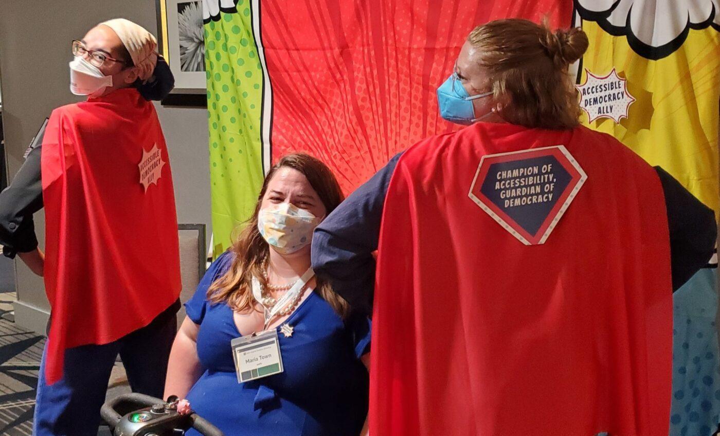 Alexia (at right) and her American Association of People with Disabilities colleagues as the superheroes they are