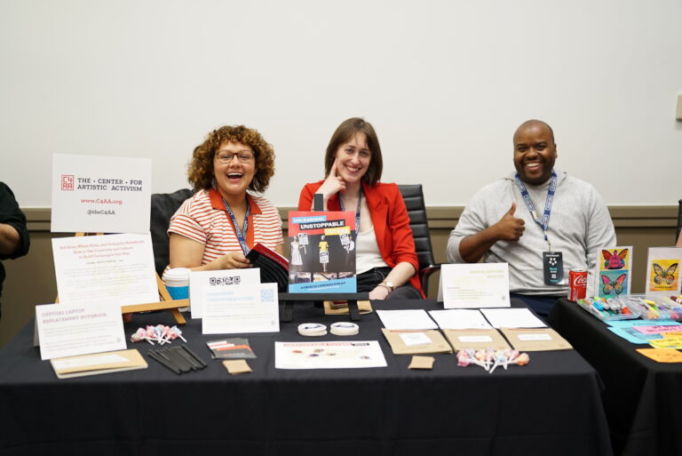 PHOTO C4AA team members tabling at Arena Summit in 2004