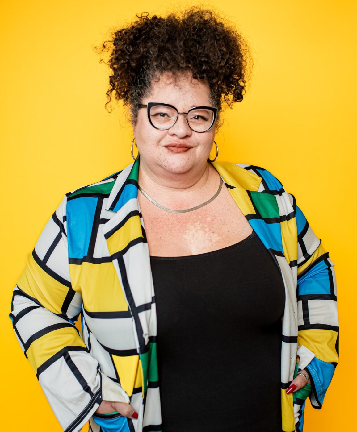 Portrait of Tigress in front of a yellow background 