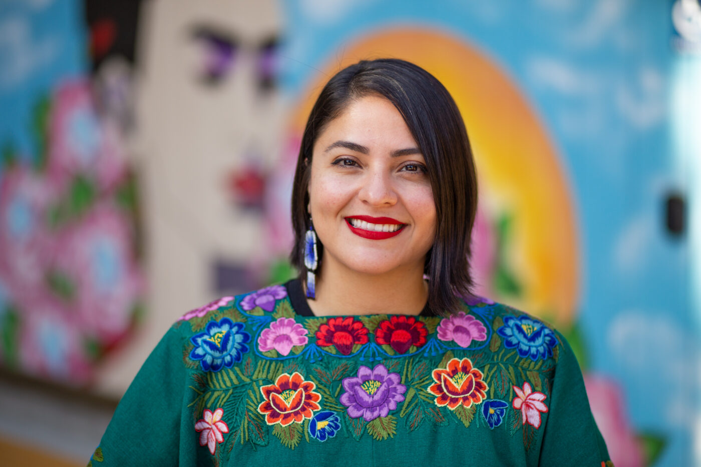 A picture of Clarissa Laguardia wearing a color floral shirt