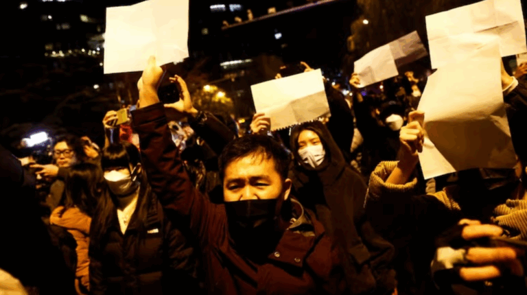 PHOTO from China's white paper protests, bunch of protestors holding pieces of blank white paper