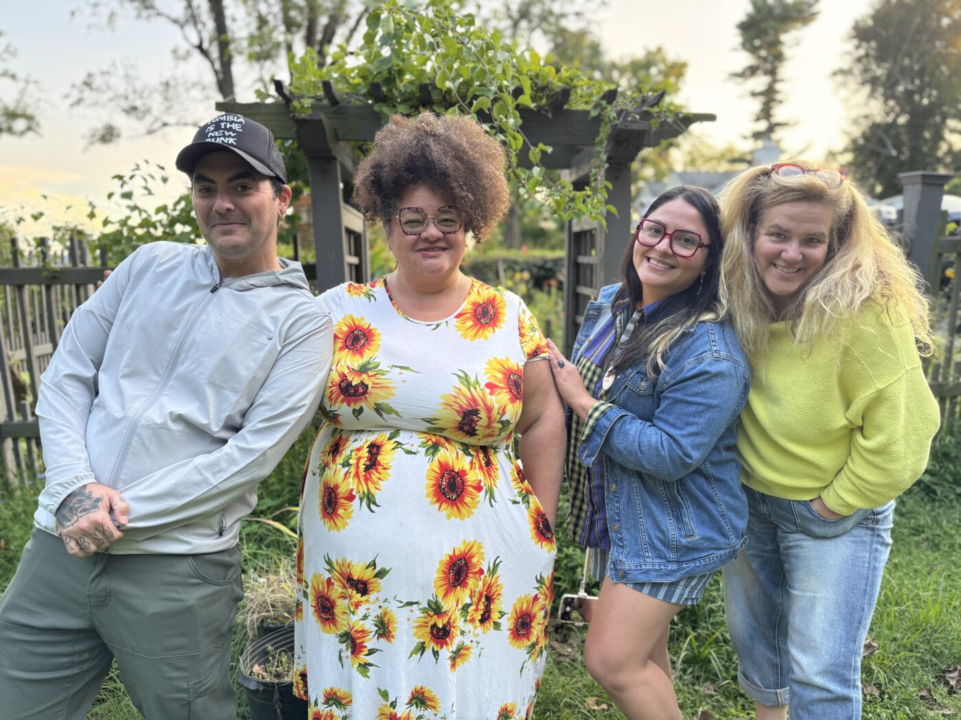 Jocelyn with her Innovation for Impact Leadership Intensive cohort members standing in front of a garden smiling 