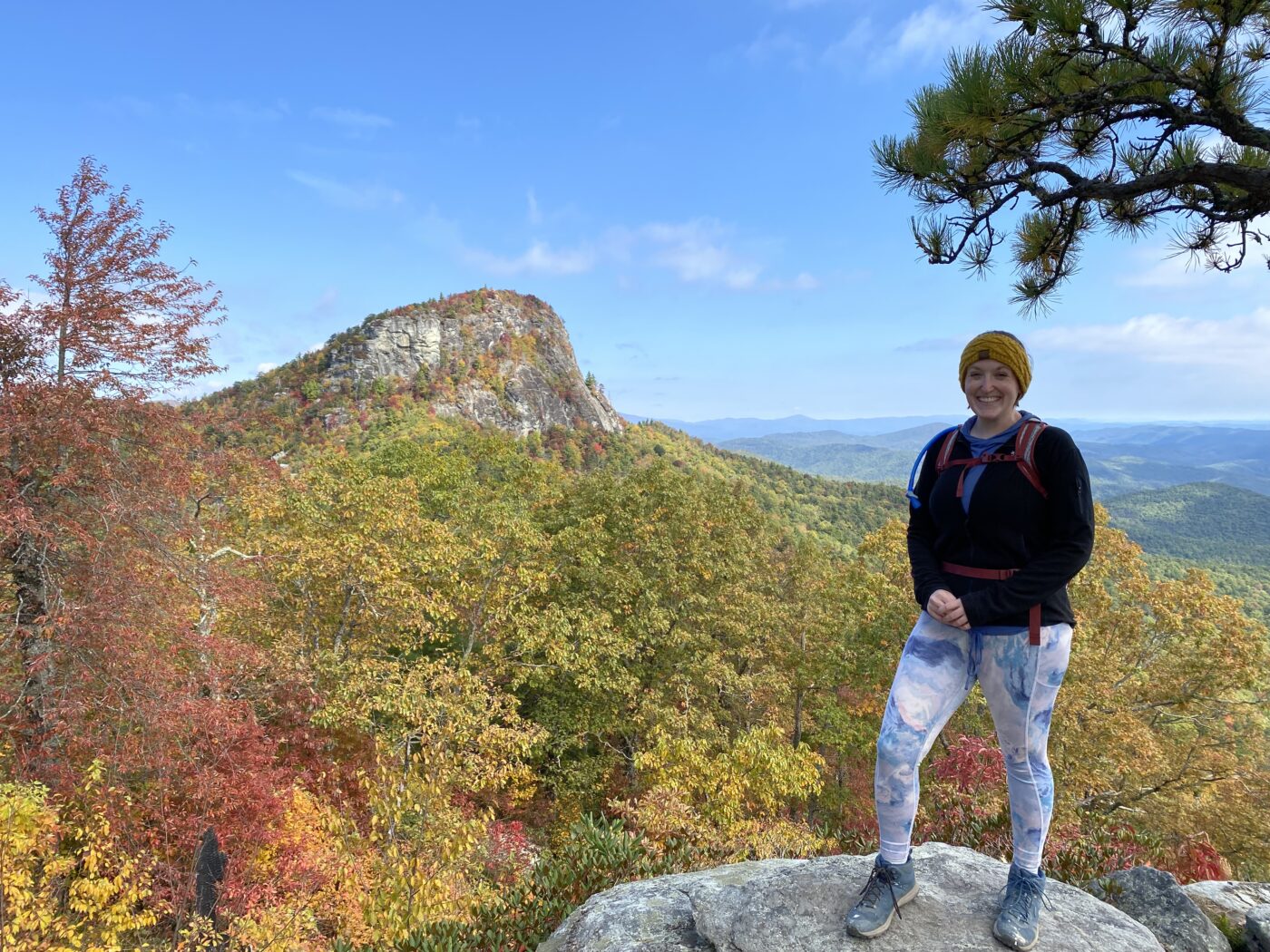 Shannon hiking in front of the blue ridge mountains 